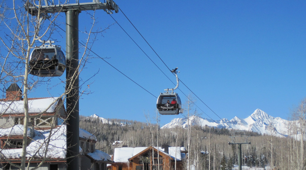 Gondola cabin traveling above Mountain village in Telluride, CO