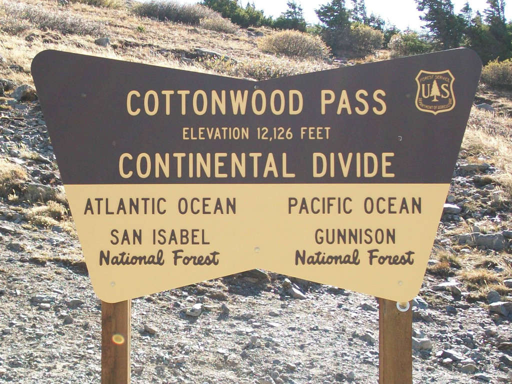 Cottonwood Pass Continental Divide sign during the summer at top of the pass