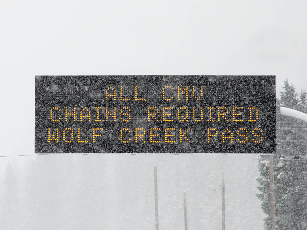 Wolf Creek Pass traffic sign for chains in Colorado on Continental Divide