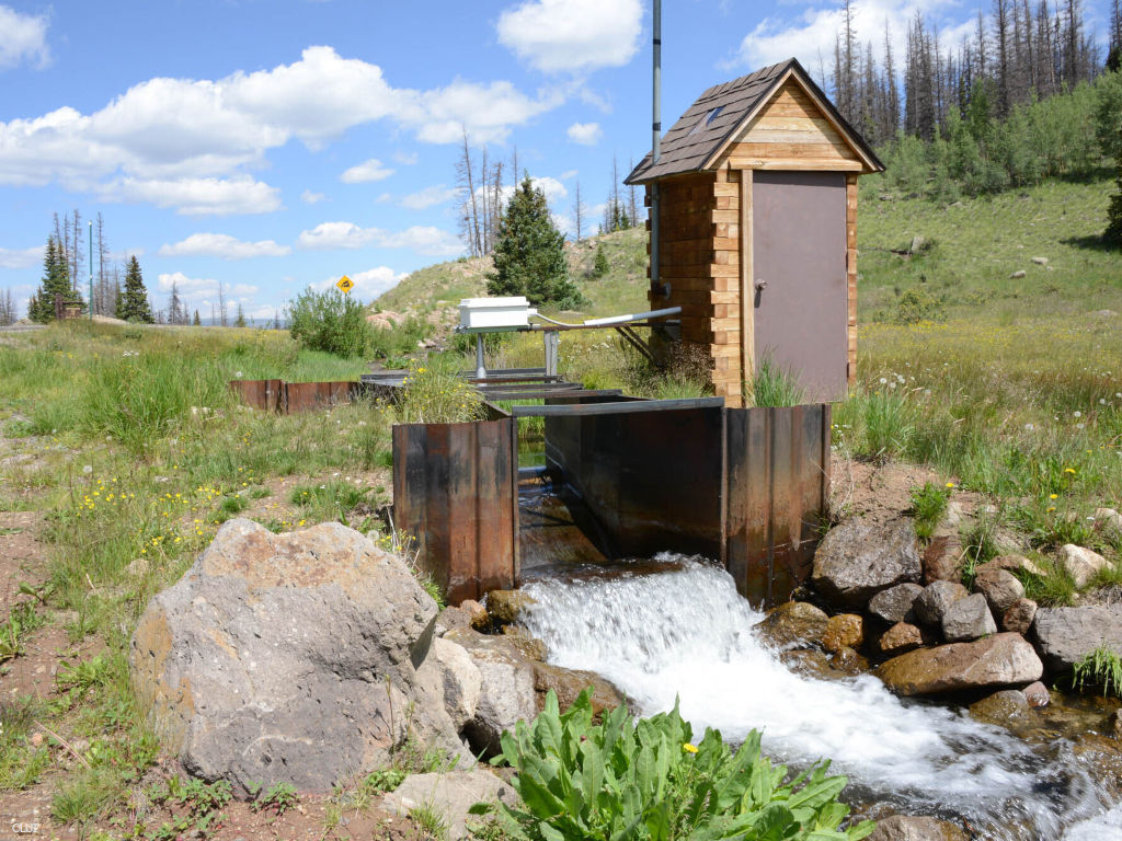 water flowing in ditch with Parshall flume on Spring Creek Pass on Continental Divide