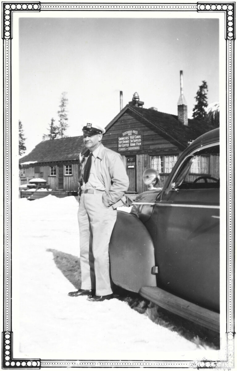 Berthoud Pass Inn at top of Berthoud Pass in early 1940s with military serviceman and his car